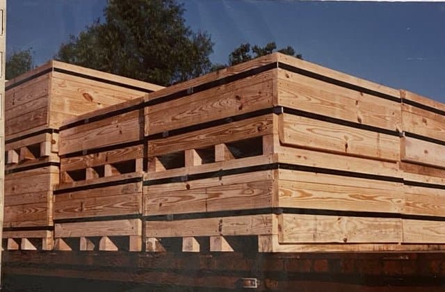 Banded bulk bins stacked in the yard